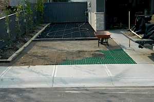 CORE Gravel and Grass parking pad being installed.