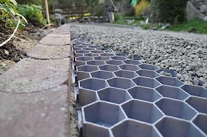 Permeable gravel driveways keep the rainwater in the soil, not sewers