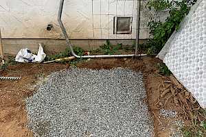 Fill the area with gravel to serve as a foundation for the foundation panel.